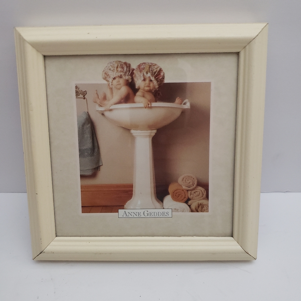 Framed print of Anne Geddes' "Babies in Handbasin". 215
